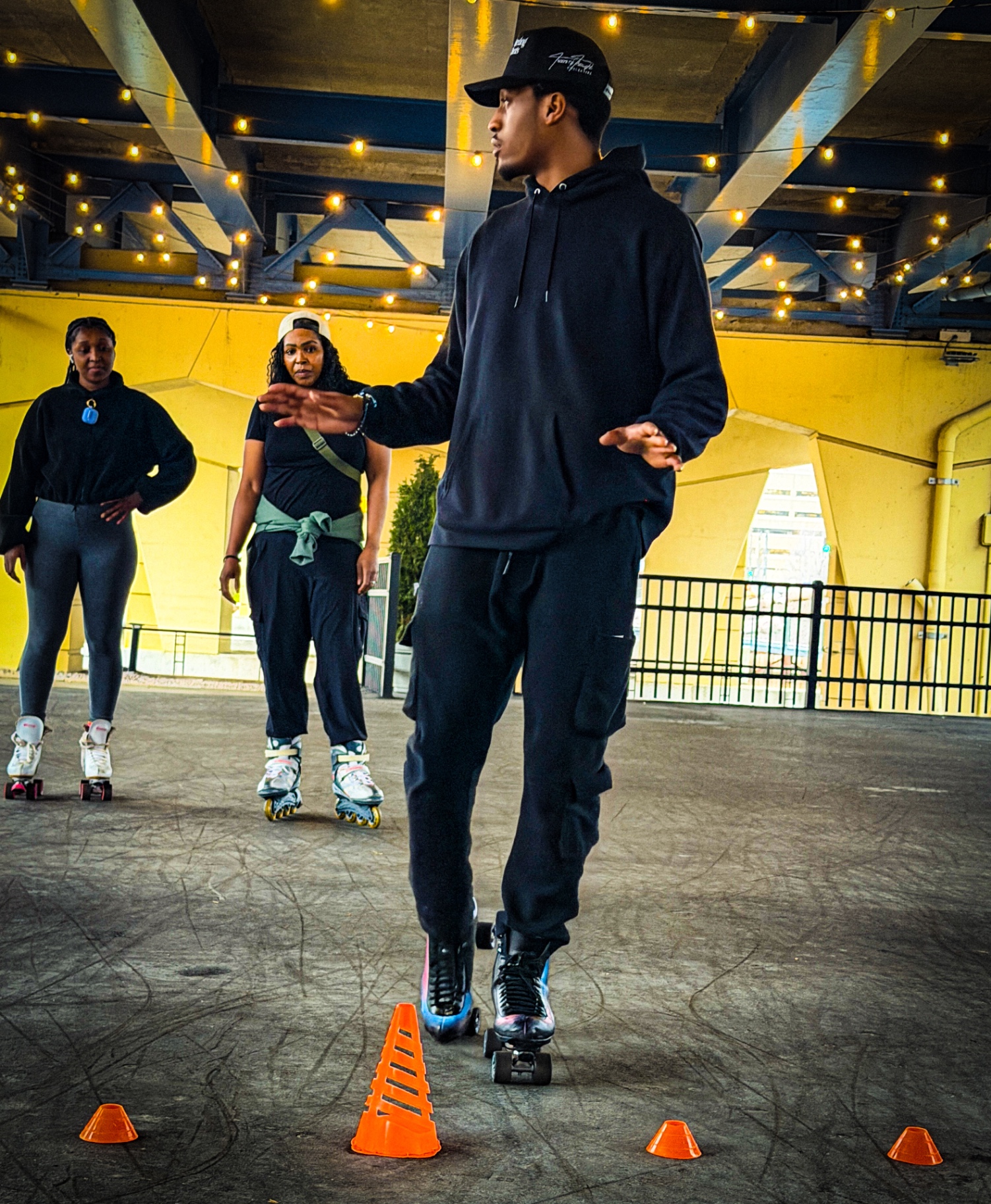 Coach guiding a roller skating student